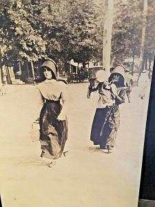 Postcard  RPPC showing Amish Women & Children on a Street in Lancaster, PA.  W8