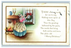 c. 1910 Lovely Lady Hanging Christmas Wreath Postcard P42