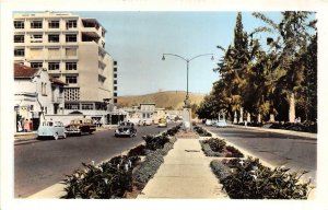 RPPC ECUADOR CARS STREET VIEW COLORIZED REAL PHOTO POSTCARD (c. 1930s)