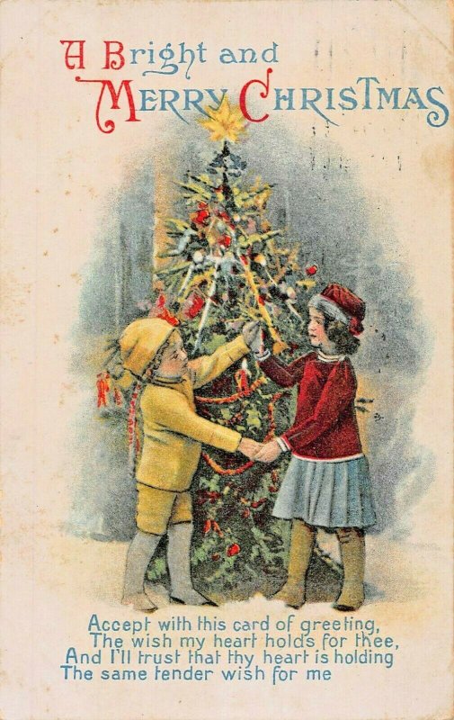 A BRIGHT AND MERRY CHRISTMAS-CHILDREN-DECORATED TREE 1916 EMBOSSED POSTCARD