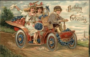 Birthday Fantasy Little Boy Drives Flower Car with Little Girls c1910 Postcard