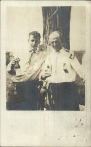 Men Celebrate - Ribbon on Shirt - Drinking Bottles of Beer c1910 RPPC