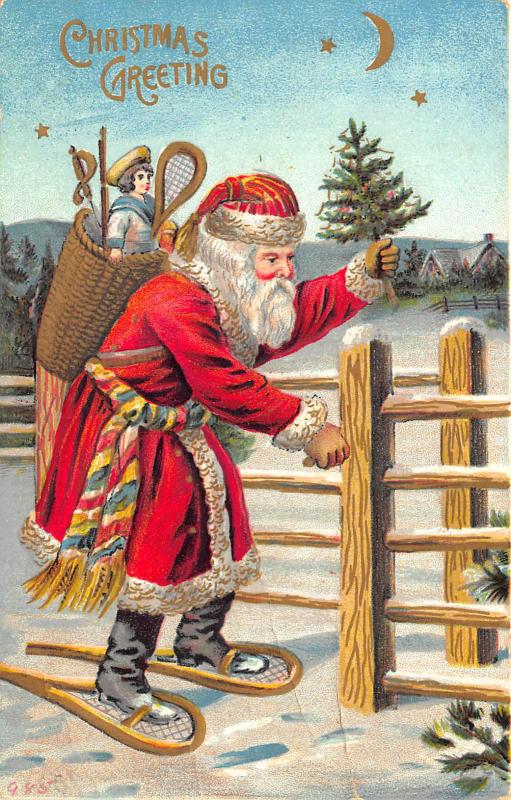 Christmas Greetings Red Suited Santa Claus Basket Fence Tree Postcard