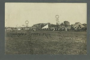 Brookings SOUTH DAKOTA RPPC 1909 COUNTY FAIR Grandstand Crowd RACES? Tents