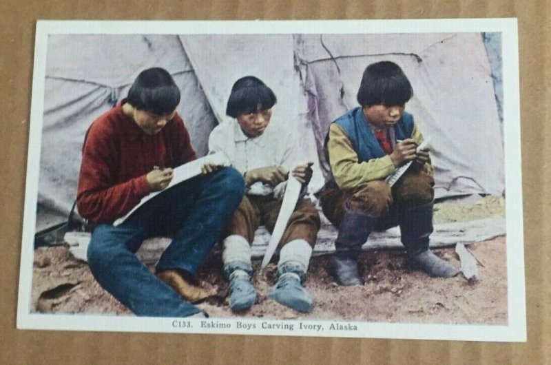   VINTAGE UNUSED LINEN POSTCARD ESKIMO BOYS CARVING IVORY ALASKA