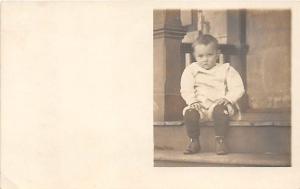 Little boy on step Child, People Photo Unused 