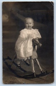 c1910's Baby Girl Riding On Rocking Horse Toy Studio RPPC Photo Antique Postcard