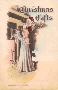 Santa Claus Watching Mother Hang Stockings Merry Christmas 1912 postcard