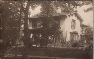 RPPC Lovely American Home House Displaying Many US Flags Postcard A24