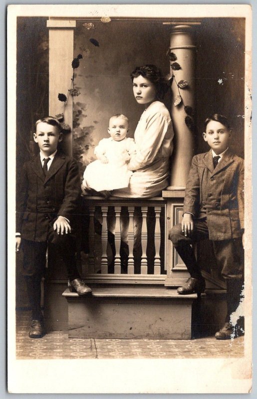 c1910 RPPC Real Photo Postcard Studio Portrait Boys In Suits Girl Holds Baby