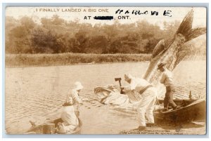 1937 Fisherman Boat Exaggerated Fish Ax Ontario Canada RPPC Photo Postcard 