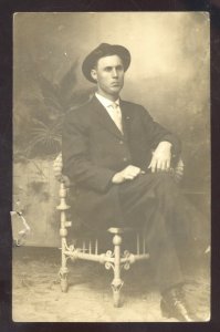 RPPC COPEVILLE TEXAS MAN IN SUIT IN CHAIR HOSKINS REAL PHOTO POSTCARD 1910