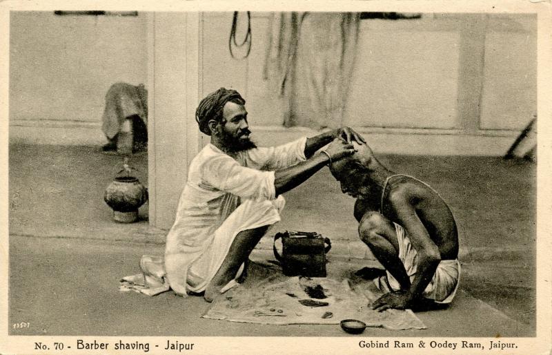 India - Jaipur. Barber Shaving a Man 