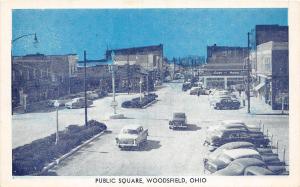 B77/ Woodsfield Ohio Postcard c1940s Public Square Monroe County Autos Stores