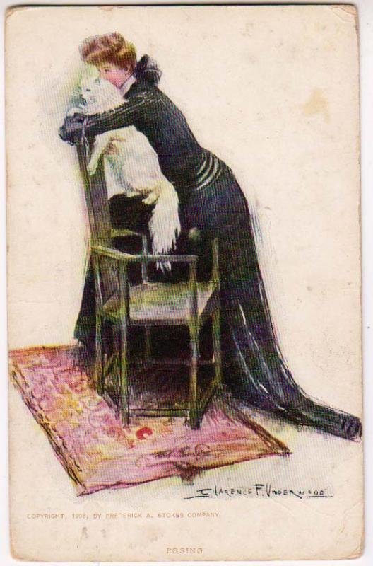 Woman Kissing her Cat, signed Clarence F. Underwood