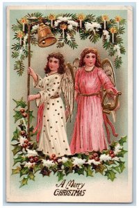 1909 Merry Christmas Angles Ringing Bells Pine Leaves Berries Embossed Postcard