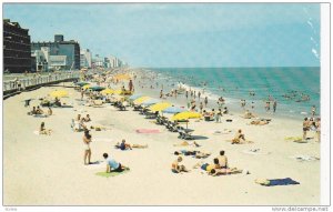 Colorful Beach,Umbrellas dot the oceanfront as casual vacationers enjoy the s...