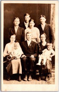 Family Photograph Adults And Infants Real Photo RPPC Postcard