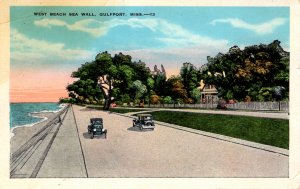 Gulfport, Mississippi - Cars driving on the West Beach Sea Wall - c1930