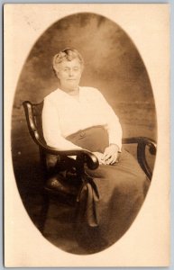 c1920 RPPC Real Photo Postcard Older Woman In Skirt Seated In Chair