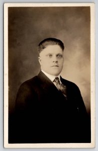 RPPC Handsome Young Man Stocky Build With Dark Eyes Studio Photo Postcard S30