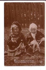 Real Photo,  'Two merry children with four puppies', Used 1914 Amherst NS