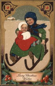 Christmas Brother and Baby Sister Snuggling on Sled c1910 Vintage Postcard