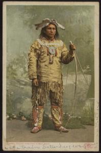 1906 Aleck, Wabunosa Ojibwa brave in traditional clothing w/bow & arrow color pc