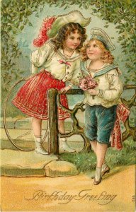 Embossed Birthday Postcard 790 Beautiful Girl & Boy at Garden Gate