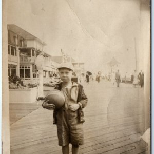 c1910s Boardwalk Young Boy RPPC Ball Play Scale Real Photo PC Scale Shops A126