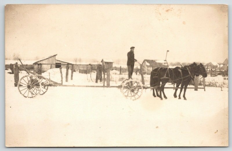 Real Photo Postcard~Pair Black Horse~Farmer on Two Wheeler~Barns in Snow~c1918