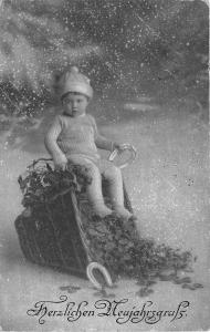 BG14656  boy child with clover and horseshoe new year neujahr germany