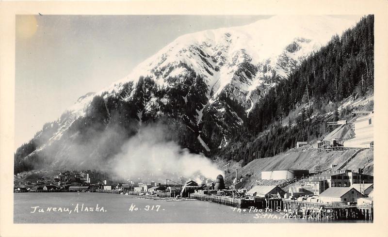 Juneau Alaska~Waterfront View~Piers-Buildings-Smoking Stacks-Mine? on Hill~RPPC