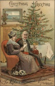 Christmas Old Man and Woman With Cat by Christmas Tree c1910 Postcard