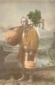 Hand Colored Postcard Portrait of Japanese Farmer in Straw Raincoat