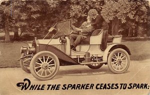 While this Barker ceases to spark Man kissing woman in model T car R.P.O., Ra...