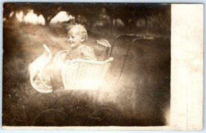 c1910s Radiant Smiling Baby RPPC Wicker Stroller Photo Beautiful Lens Flare A142