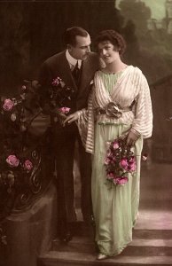 c1910 ROMANTIC COUPLE ROSES STUDIO BACKDROP TINTED PHOTO RPPC POSTCARD P1365