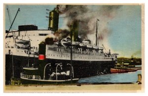 Saint John, large ocean liner , tug boats