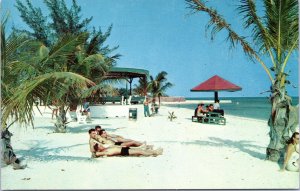 postcard FL Men sunbathing at Monroe County Beach, Key West