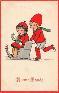 L375 New Year Greetings 1922 Children skate sledge shamrock luc vintage postcard
