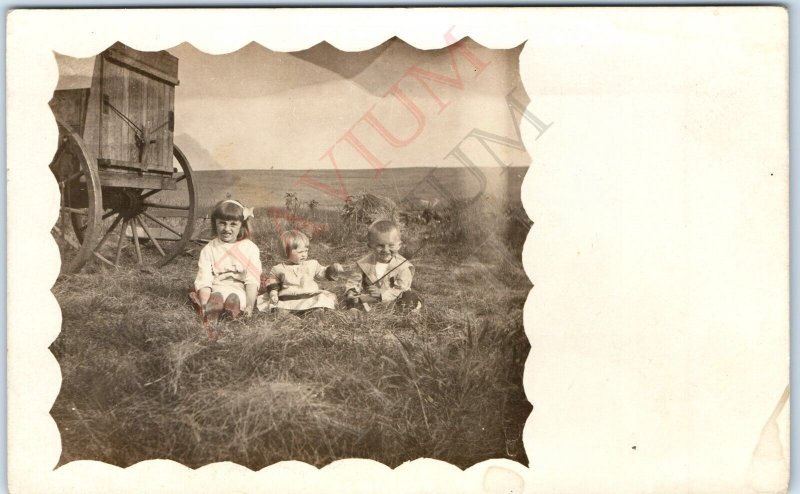 c1910s Cute Children Play Outdoors RPPC Hay Wagon Farm Border Happy Photo A167