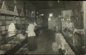 Beautifully Detailed Store Interior Cans Woman at Counter Checking Out RPPC