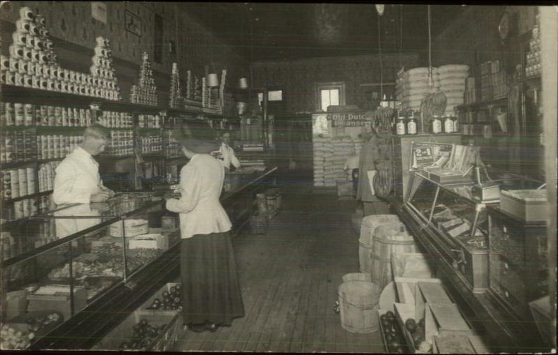 Beautifully Detailed Store Interior Cans Woman at Counter Checking Out RPPC