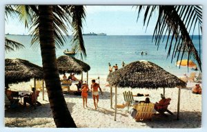 NASSAU, Bahamas~ Beautiful PARADISE BEACH Scene Thatched Cabanas c1950s Postcard