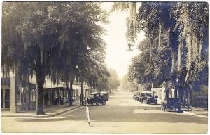 Mt. Dora FL Main St Bakery Pharmacy Old Cars Mobil Gas Real Photo RPPC Postcard