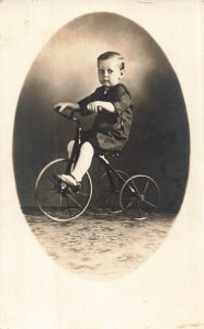 CUTE YOUNG BOY CLARENCE EDWARDS ON TRICYCLE~1919 REAL PHOTO POSTCARD