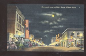 COEUR D'ALENE IDAHO DOWNTOWN STREET SCENE AT NIGHT VINTAGE POSTCARD OLD CARS