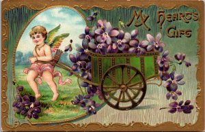 Be My Valentine Cupid Pulling Cart Load Of Purple Flowers