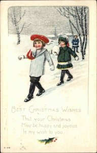 Christmas Little boy and Girl in Snow Blizzard c1910 Vintage Postcard